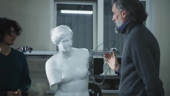 Designer and Client Discussing 3D Sculpture alt