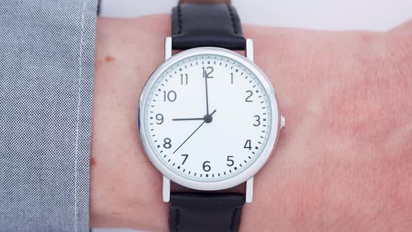 Close up of a man wearing a wrist watch