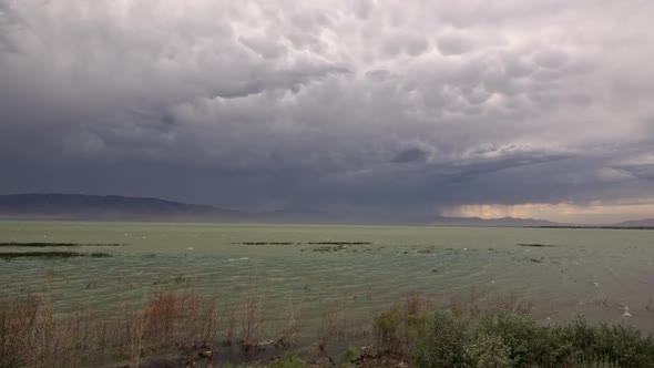 Wind pushing waves on Utah Lake during storm moving through the valley alt