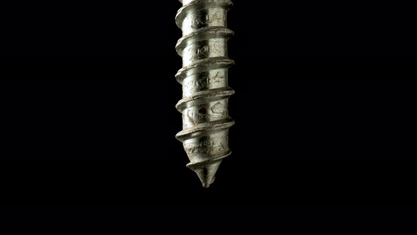 Sharper of a Steel Screw or Metal Bolt Rotating on Isolated Black Background alt