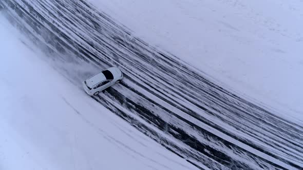 Aerial View of The Rally Car on A Snowy Road