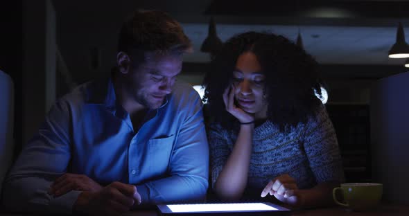 Young office executives working over digital tablet in a modern office alt