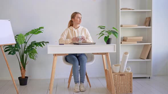 Young Caucasian Woman Drinking Tea Workplace