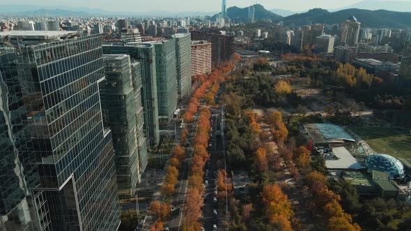 Aerial View Of Araucano Park In Autumn Colors With Skyline Of Santiago, Chile. alt