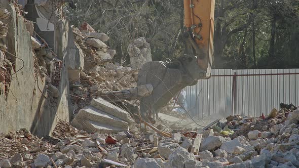 Hands Shot Of House Debris Cleaning With Excavator 1 alt