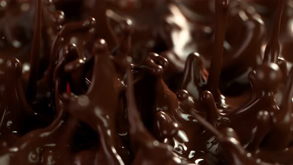 Super Slow Motion Detail Shot of Splashing Melted Chocolate at 1000 Fps alt