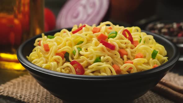 Instant noodles on black background, spicy asian lunch, ProRes uncompressed alt