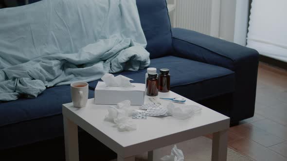 Close Up of Medicaments and Thermometer on Coffee Table alt