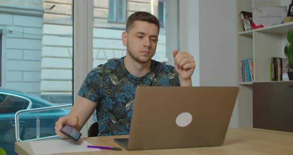 Man Freelancer Using Laptop Online Working in Internet, Guy Typing on Computer Surfing Web Looking alt