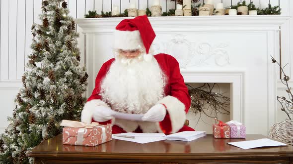 Santa Claus Sorting Out Paper Letters From Children alt
