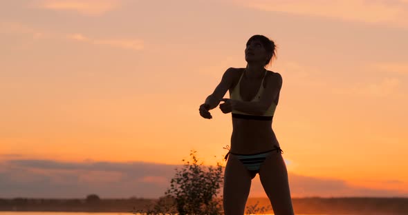 Serve Reception Volleyball Beautiful Woman in Bikini on Beach at Sunset alt