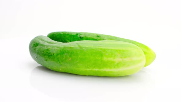 Cucumber and half cucumber rotation isolated on white background, Close up