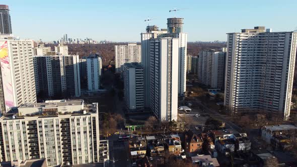 4k ascending drone shot of SJT community in downtown Toronto with a view of tall high-rise apartment alt