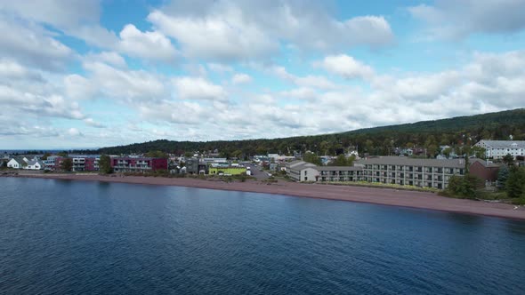 Drone shot of downtown Grand Marais, MN on a sunny summer afternoon alt