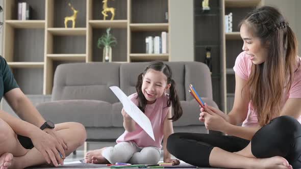 Family holiday activities where parents and children play together happily alt