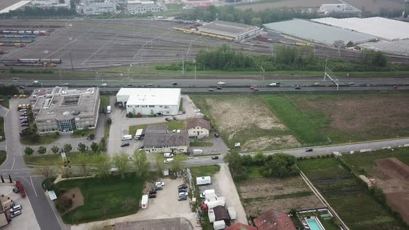 Tilt up, drone aerial view of an highway and geneva lake, near Morges, Switzerland alt