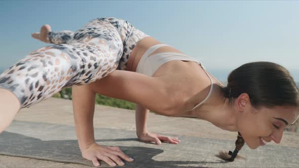 Woman Stretching Body at Viewpoint of Barcelona. Flexible Woman Doing Yoga alt