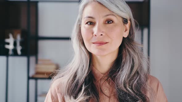 Portraits of a Gray Long Hair Asian Matured Happy Multiracial Smiling Woman alt