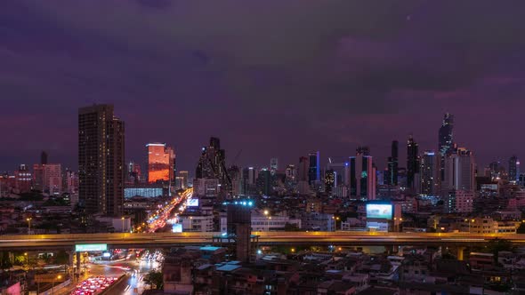 Bangkok business district city center and expressway during twilight, day to night - Time Lapse