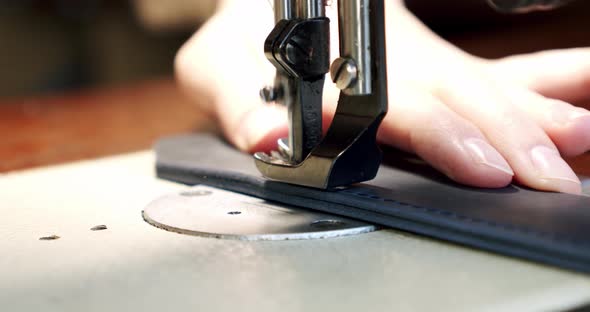 Professional sewing machine in action, leather sewing needle alt