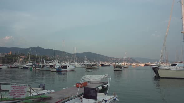 Boats and Yachts at the Mooring in Rapallo at Summer Sunset Italy  2K Editorial Wide Shot Pan alt