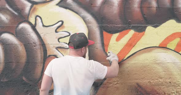 Graffiti Artist with Aerosol Spray Bottle