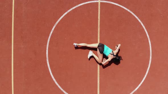 Aero, Top View, Fitness Woman in Sportswear Doing Various Exercises, Background of Orange Basketball alt