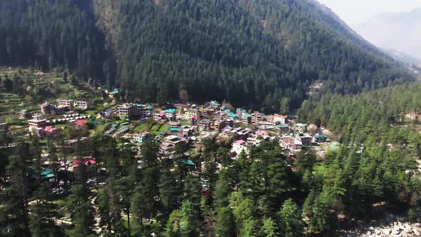 Kasol remote rural village in india Himalaya Parvati valley mountains aerial view of green natural f alt