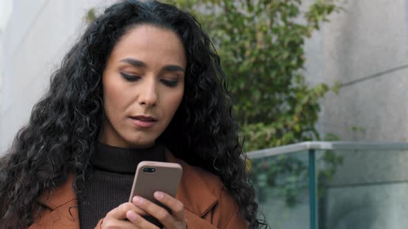Female Portrait Face Serious Latin Hispanic Girl Young Business Woman Walks on Street with alt