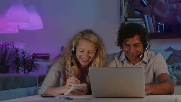 happy smiling couple in smart work at home in the evening