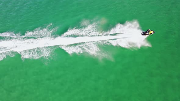 Aerial of Jet Ski Driving on the Atlantic Ocean in Dwoning County Donegal  Ireland alt