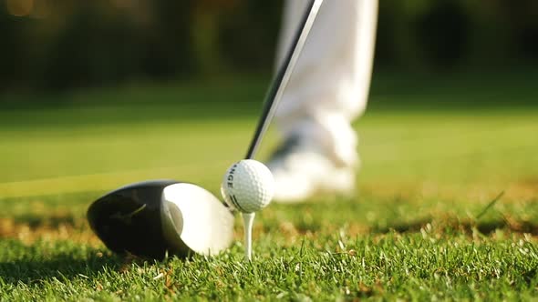 Golfer striking a ball alt