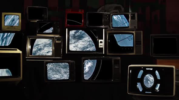 View of Earth through the Cupola on the International Space Station and Many Retro TVs.