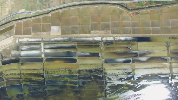 View from above of road passing salt fields of Pag island, Croatia alt