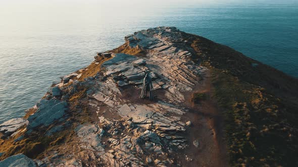 Aerial view around the Monument to King Arthur in Britain Monument close up on sea background