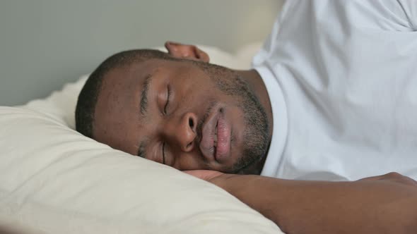 Young African Man Snoring in Bed, Sleeping  alt