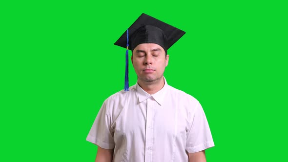 Young Male Smiling Graduate College in Black Hat Doing Thumbs Up on Chroma Key Background alt