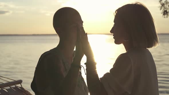 Couple touching hands of each other.