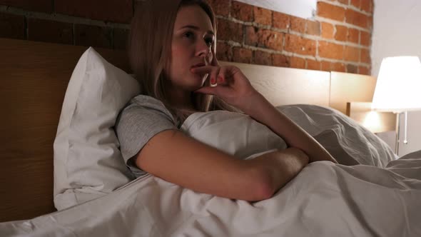 Pensive Woman Thinking and Brainstorming, Relaxing in Bed alt