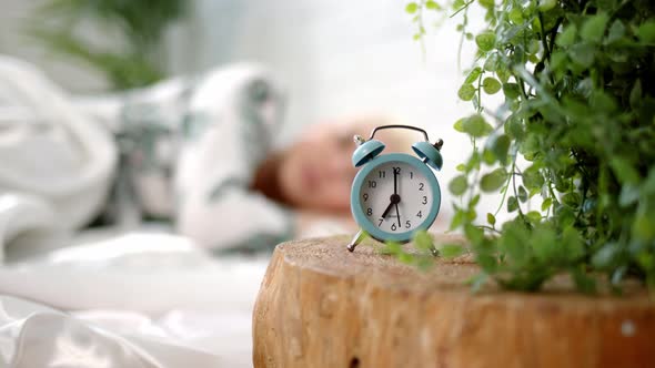 Pretty Young Blonde Woman with Short Haircut Wakes Up in Bed at Home or in Hotel in Morning and alt