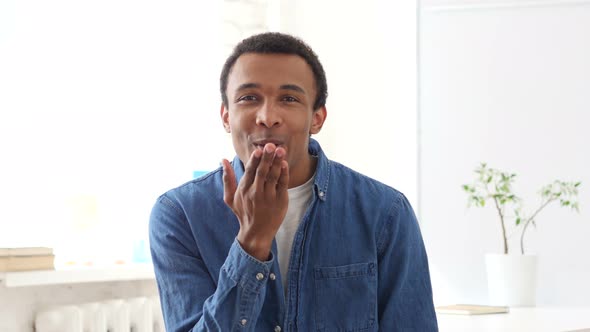 Flying Kiss by Young Afro-American Man, Portrait alt