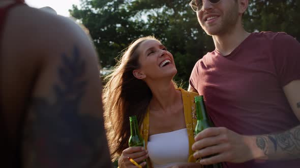 Group of young friends spending time on the camper side. Shot with RED helium camera in 8K alt