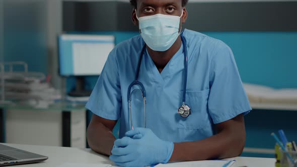 Portrait of Man with Nurse Occupation Looking at Camera alt