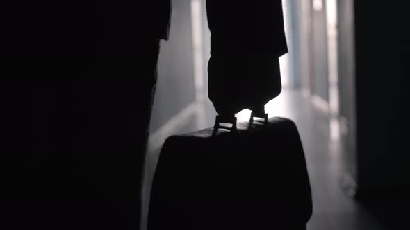 Hand of Entrepreneur Carrying Briefcase along Hallway