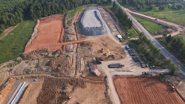 An Aerial View of a Large Area with a Pile of Stacked Granite Rubble alt