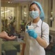 Female Asian Doctor Measuring Patient Temperature - VideoHive Item for Sale