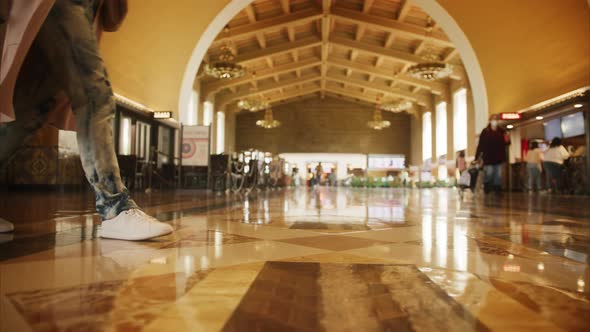 Slow Motion Woman in White Shoes Walking By Marble Floor in Railroad Station 6K alt