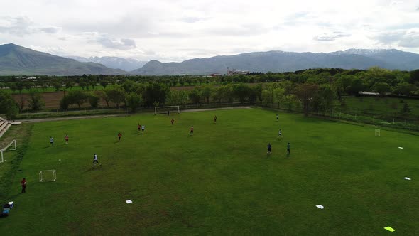 Aerial View of Kids Football Team During Training