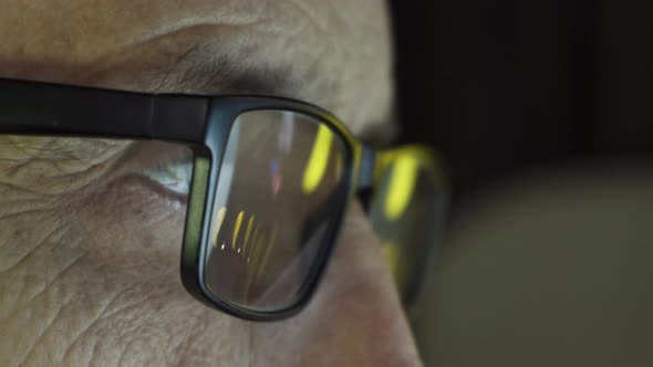 Focused Eyes of a Businessman Wearing Computer Glasses alt