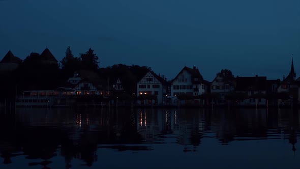 Night Embankment on the Banks of the Rhine River in Switzerland. alt